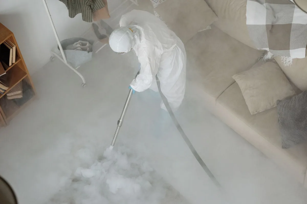 Biohazard cleanup technician in protective equipment, Mattituck, NY